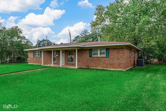 ranch-style house featuring central AC unit and a front lawn