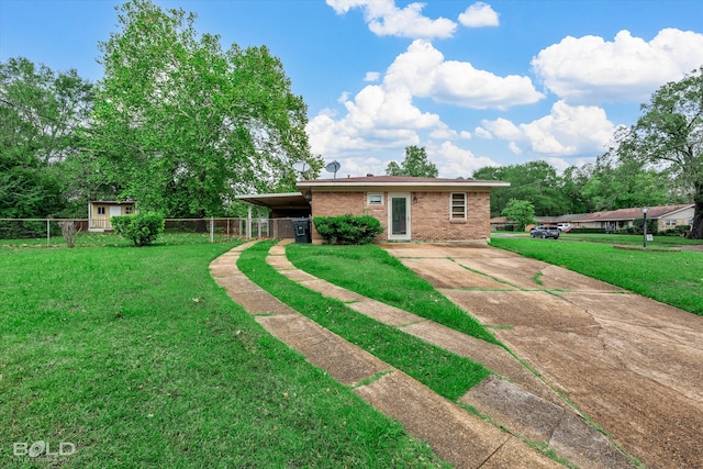 back of house featuring a carport and a lawn