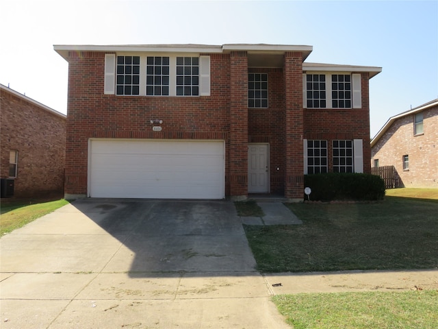 view of front of home with a front lawn and a garage