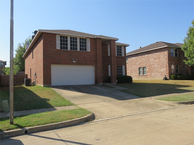 view of front of house with a front yard and a garage