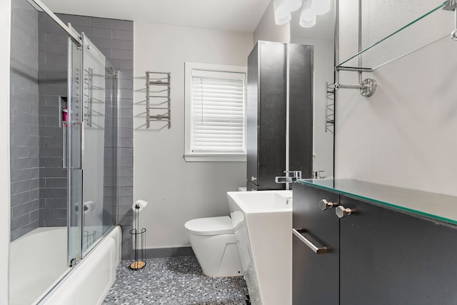 full bathroom featuring vanity, toilet, and enclosed tub / shower combo