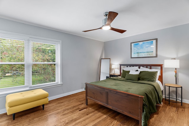 bedroom featuring ceiling fan and hardwood / wood-style floors