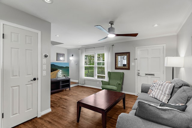 living room with hardwood / wood-style flooring, ceiling fan, and ornamental molding