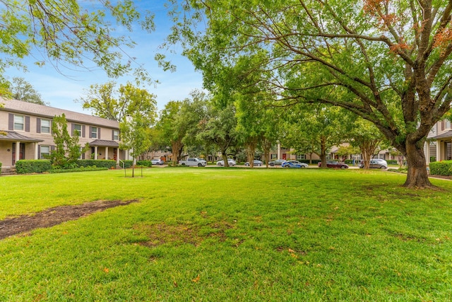 surrounding community featuring a yard