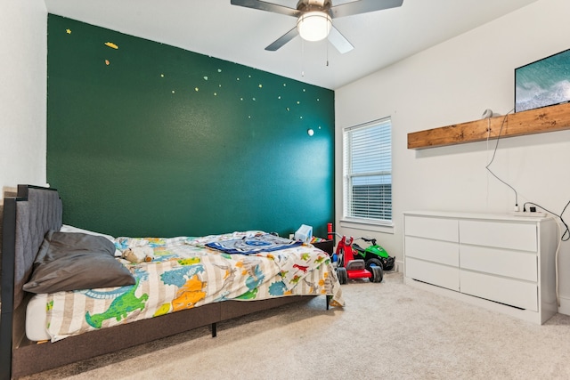 bedroom featuring ceiling fan and carpet floors