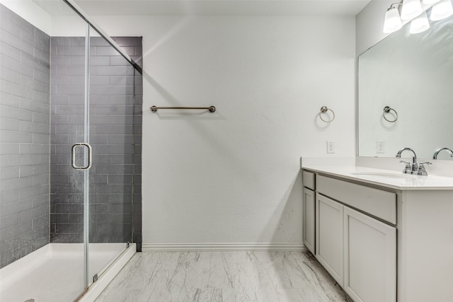 bathroom featuring vanity and a shower with door