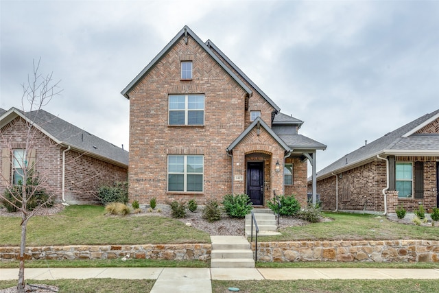 view of front of property with a front lawn