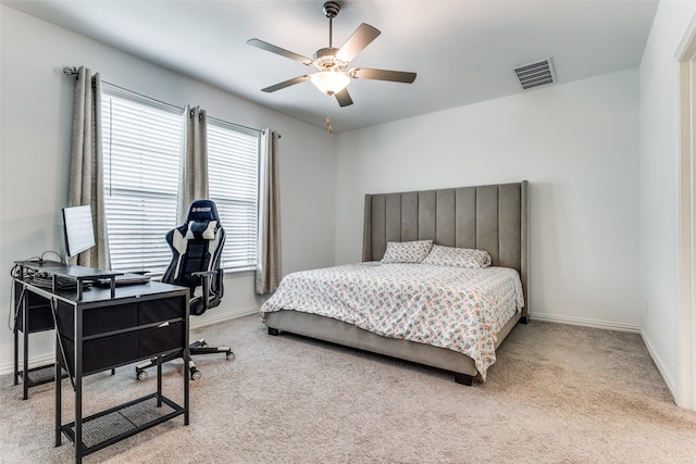 bedroom with ceiling fan and light colored carpet