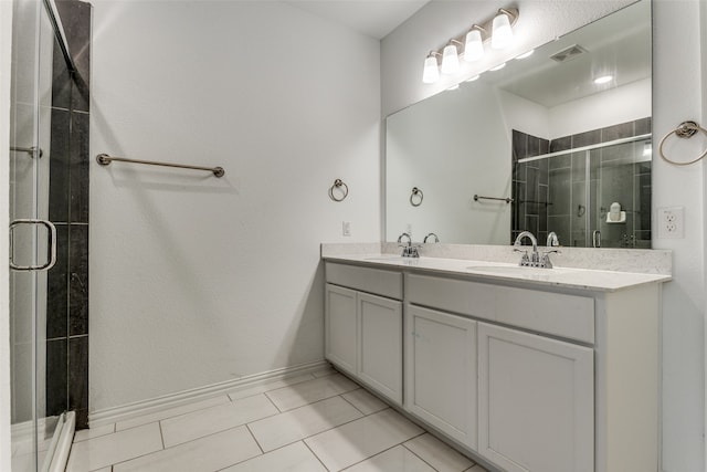 bathroom featuring vanity, walk in shower, and tile patterned floors