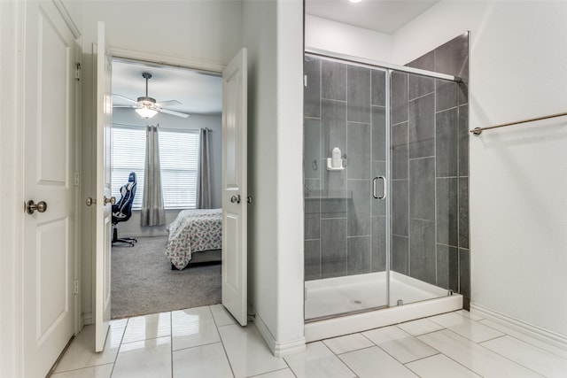 bathroom with an enclosed shower, ceiling fan, and tile patterned floors