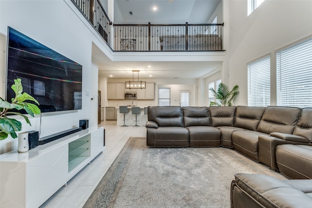 tiled living room with a towering ceiling