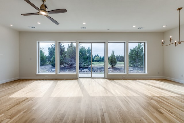 empty room with ceiling fan and light wood-type flooring