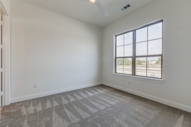 empty room featuring hardwood / wood-style floors, a healthy amount of sunlight, and an inviting chandelier