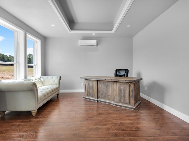 home office with dark hardwood / wood-style flooring, a tray ceiling, and a wall mounted air conditioner