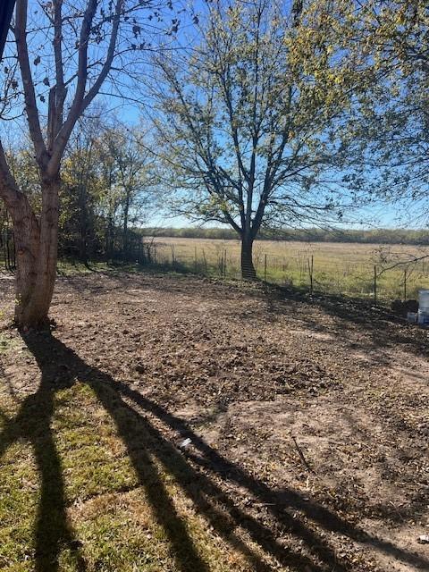 view of yard with a rural view