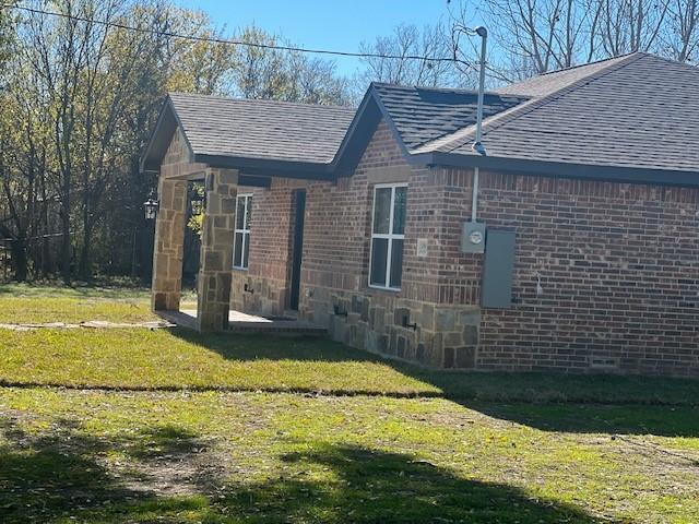 view of home's exterior featuring a yard