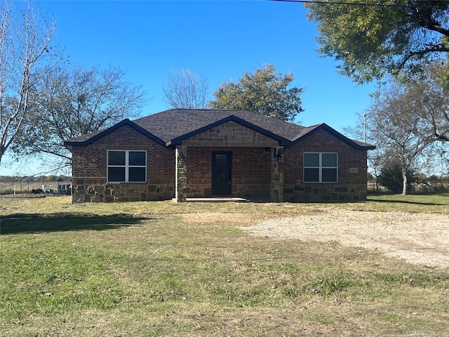 ranch-style home with a front yard