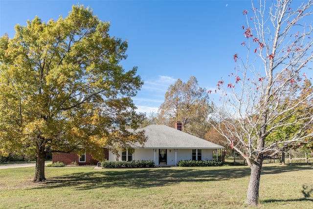 ranch-style home with a porch and a front yard