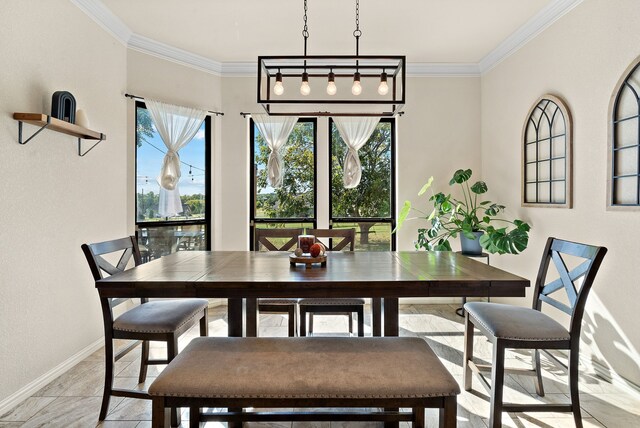 dining room featuring crown molding