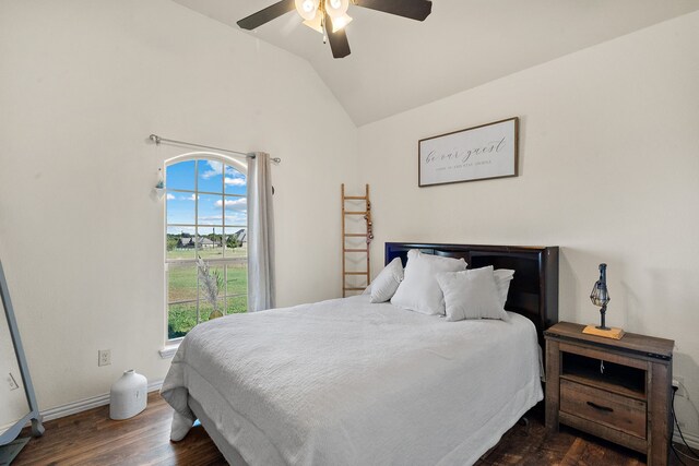 bedroom with dark wood-type flooring, ceiling fan, and lofted ceiling