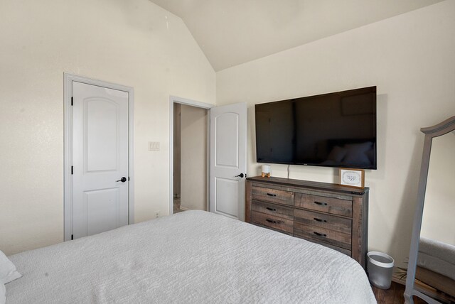 bedroom with vaulted ceiling