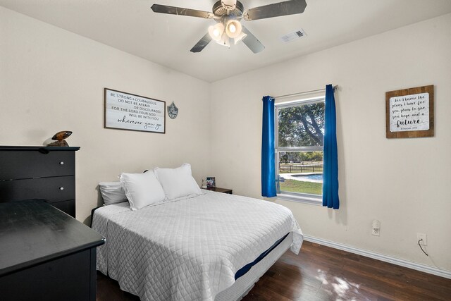 bedroom with ceiling fan and dark hardwood / wood-style floors