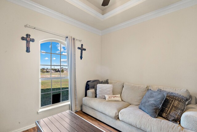 living room with hardwood / wood-style flooring and crown molding