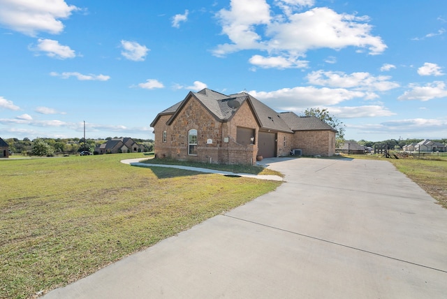 view of front facade with a garage and a front lawn