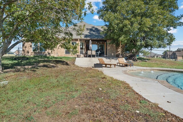 rear view of property featuring a patio area