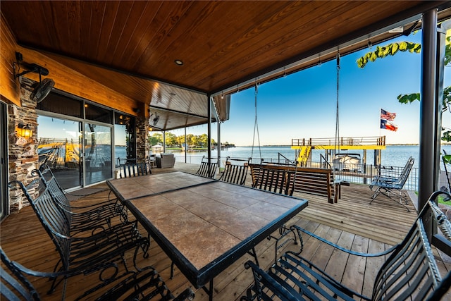 sunroom featuring wood ceiling, a water view, and vaulted ceiling