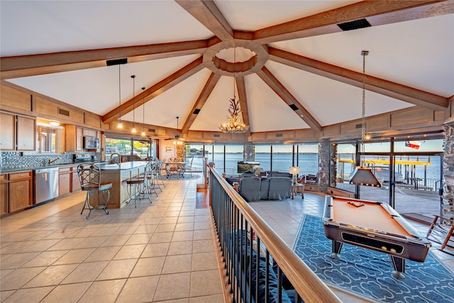 recreation room with high vaulted ceiling, a water view, billiards, and beam ceiling