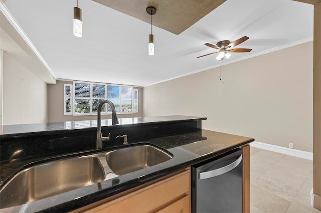 kitchen featuring a sink, baseboards, ornamental molding, stainless steel dishwasher, and pendant lighting