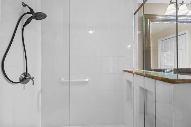 bathroom with a shower with shower door