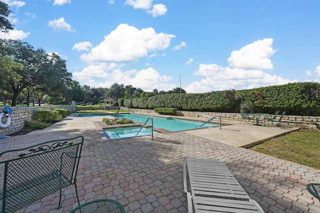 view of pool featuring a patio