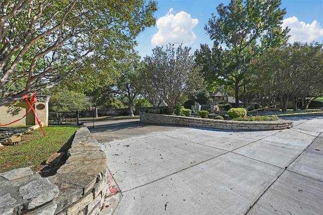 view of community with fence