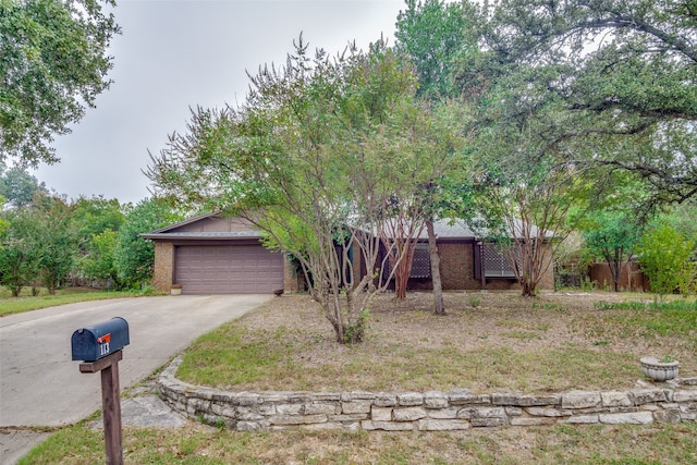 obstructed view of property featuring a garage