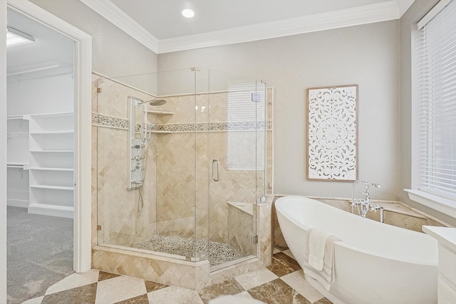 bathroom featuring crown molding and separate shower and tub