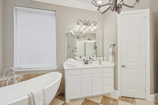 bathroom featuring vanity, crown molding, a tub, and a chandelier