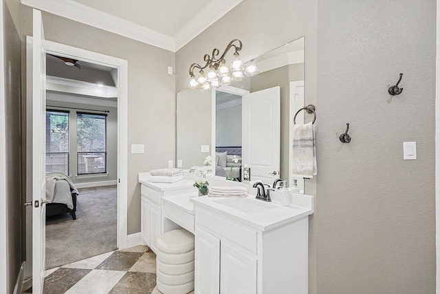 bathroom featuring vanity, ornamental molding, and an inviting chandelier