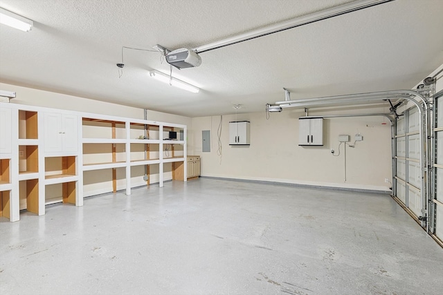 garage with a garage door opener and electric panel