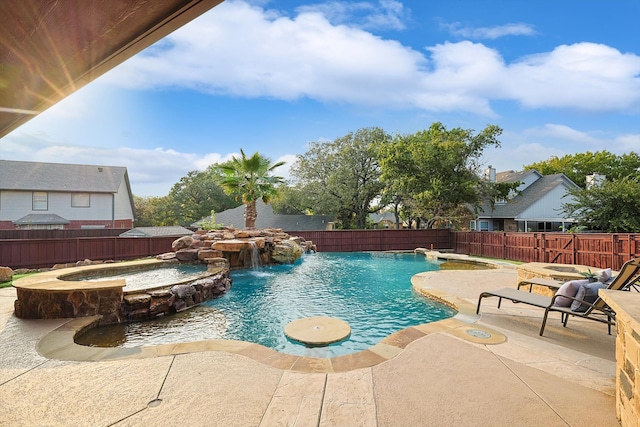 view of swimming pool featuring an in ground hot tub, pool water feature, and a patio area