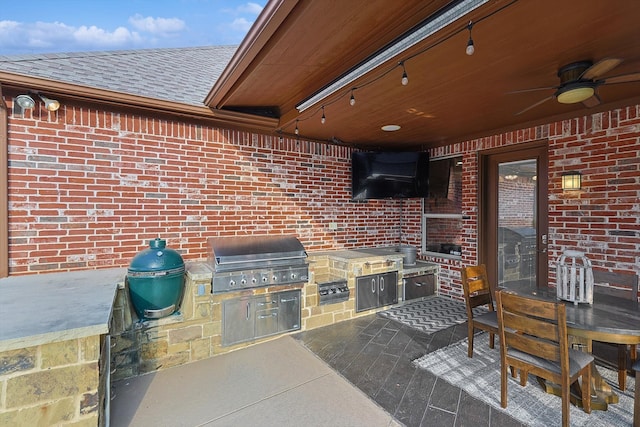 view of patio / terrace featuring area for grilling and ceiling fan