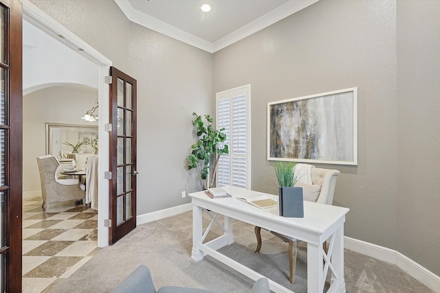 carpeted office space featuring french doors and crown molding