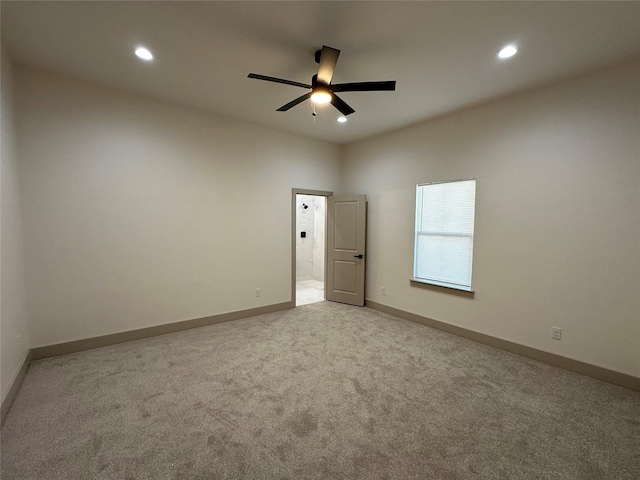 carpeted empty room with ceiling fan