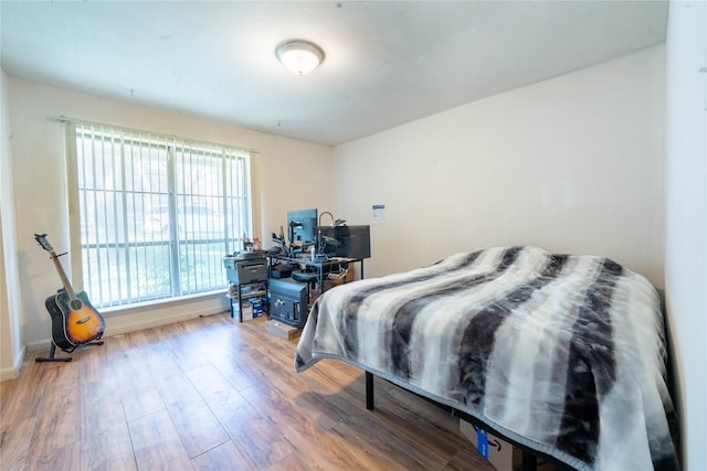 bedroom with light wood-type flooring