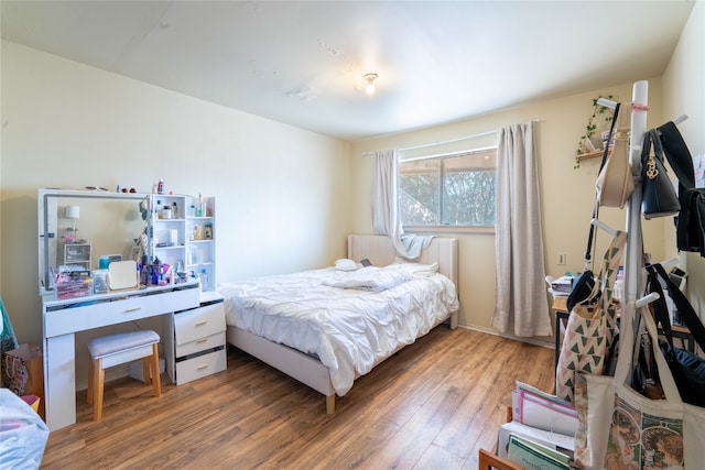 bedroom with wood-type flooring