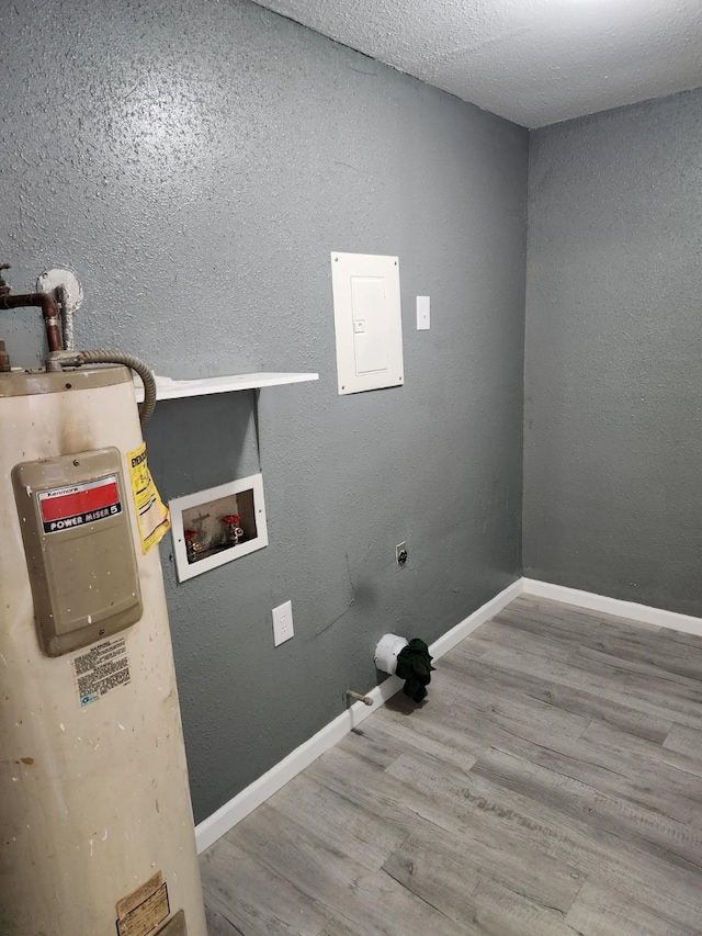 washroom featuring hardwood / wood-style floors, hookup for a washing machine, and electric dryer hookup