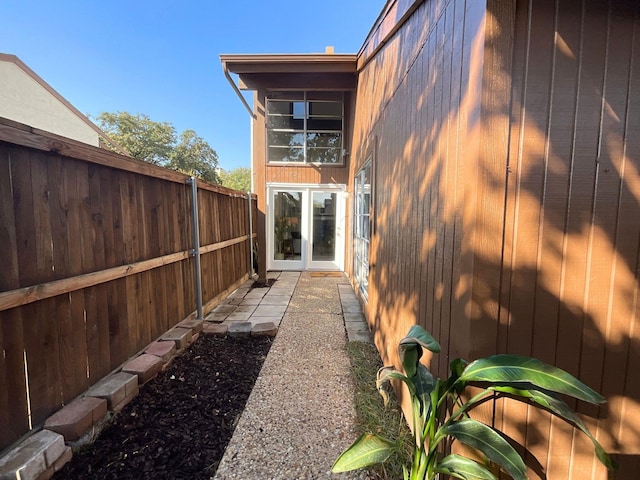 view of side of property featuring french doors