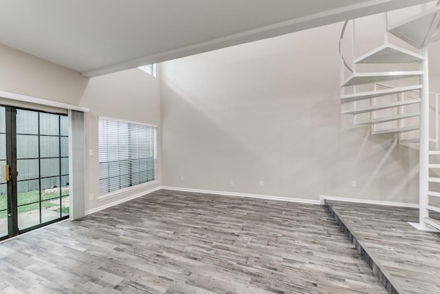 unfurnished living room featuring hardwood / wood-style flooring