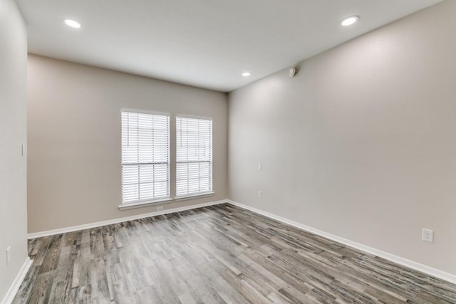 unfurnished room featuring wood-type flooring